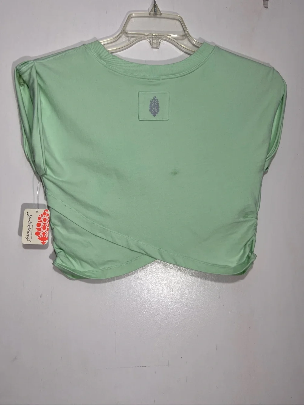 NWT FP Movement Pistachio green hot shot crossover top size L